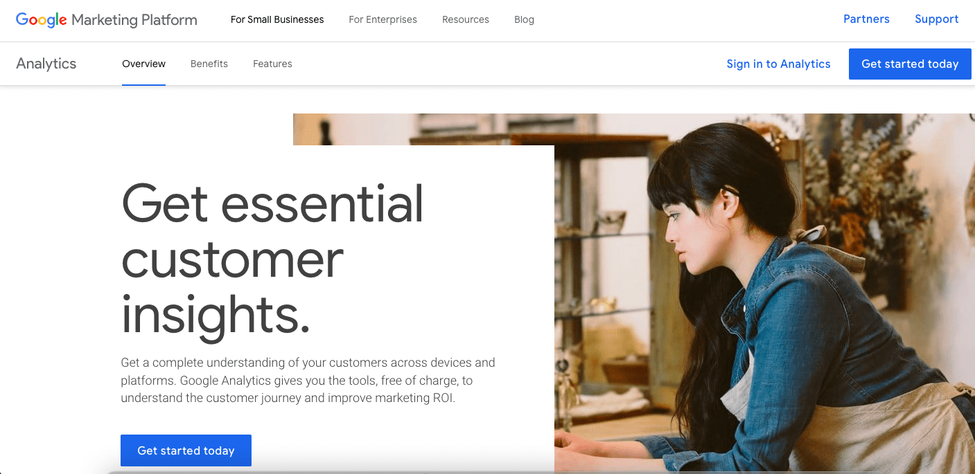 Screenshot of the Google Marketing Platform webpage featuring a "Get essential customer insights" section. A woman, focused and typing on a laptop, is pictured on the right. Various navigation options like Overview, Benefits, and Features are at the top.